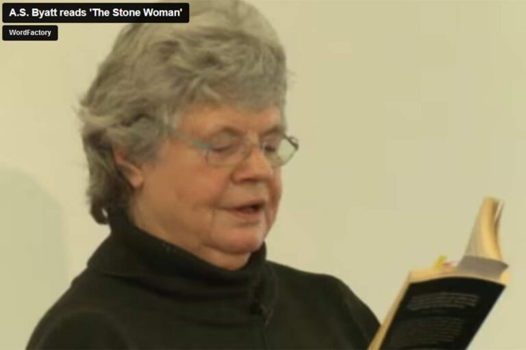 A. S. Byatt reads from a book.